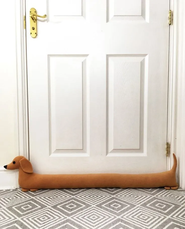 DIY fabric draft stopper placed under a door